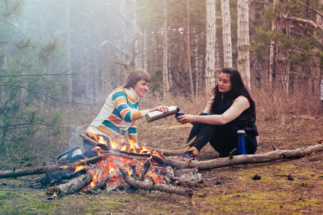 Photo by Oleksandr P: https://www.pexels.com/photo/two-women-sitting-in-front-of-burning-firewood-344100/